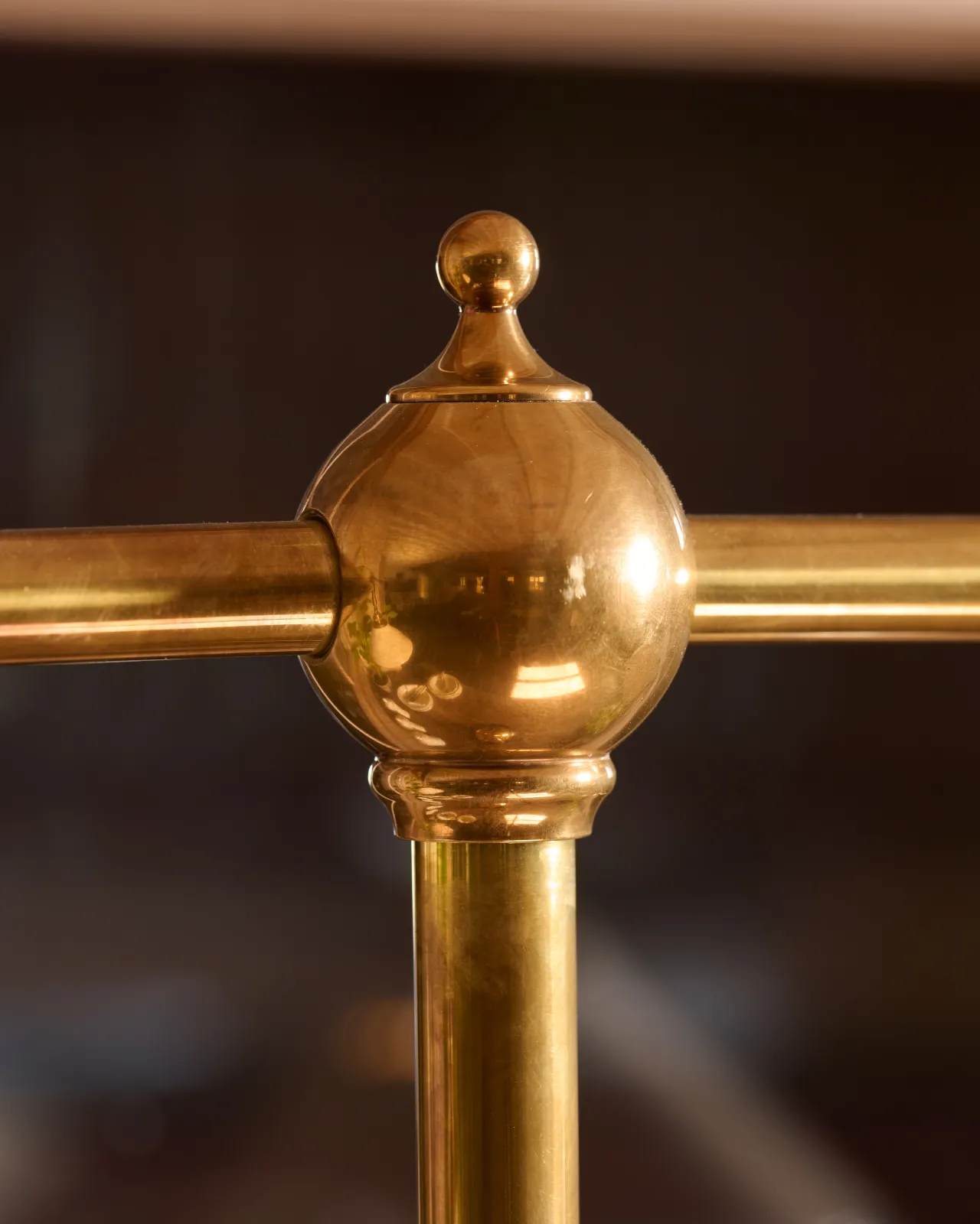 A close-up view of a pointed brass finial.
