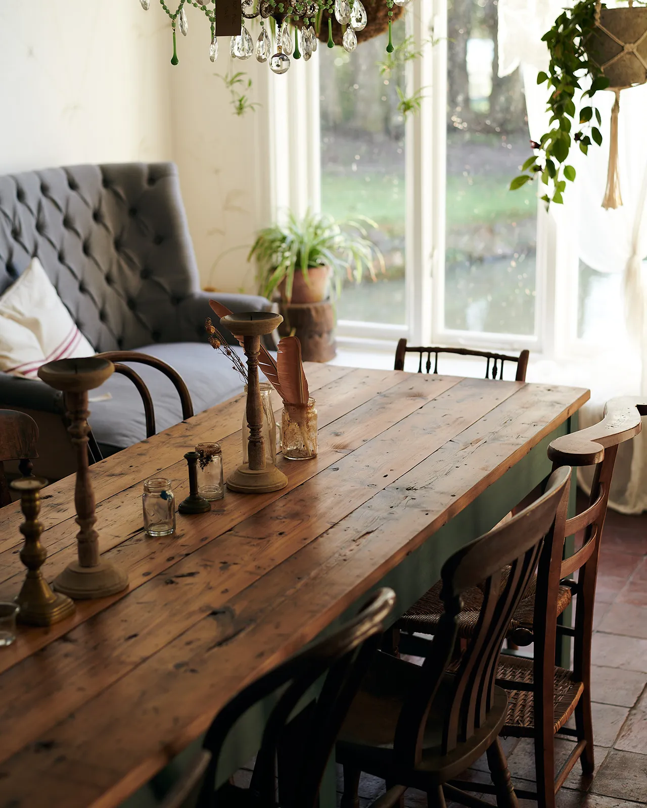 An oblique view of a rustic pine tabletop from a banquet-style dining table.