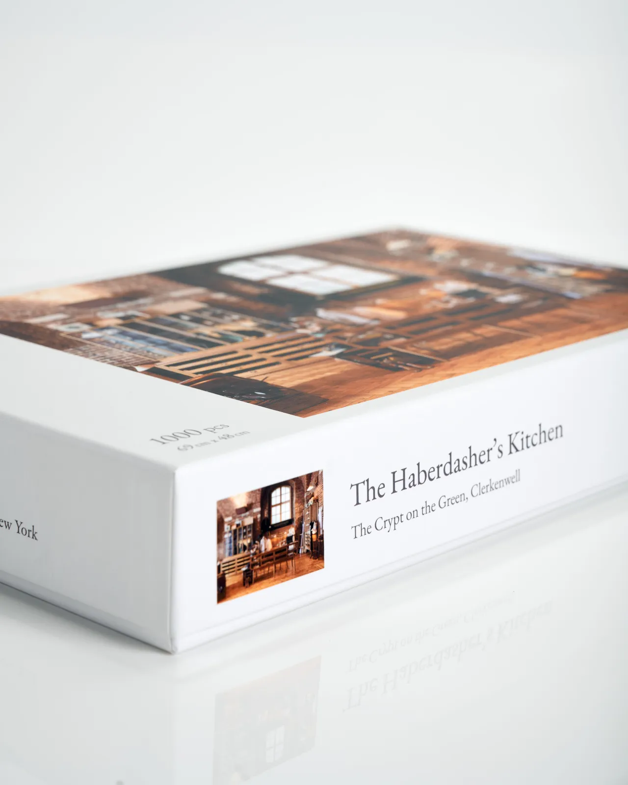 An oblique view of a white jigsaw puzzle box with the title 'The Haberdasher's Kitchen; the Crypt on the Green, Clerkenwell'.