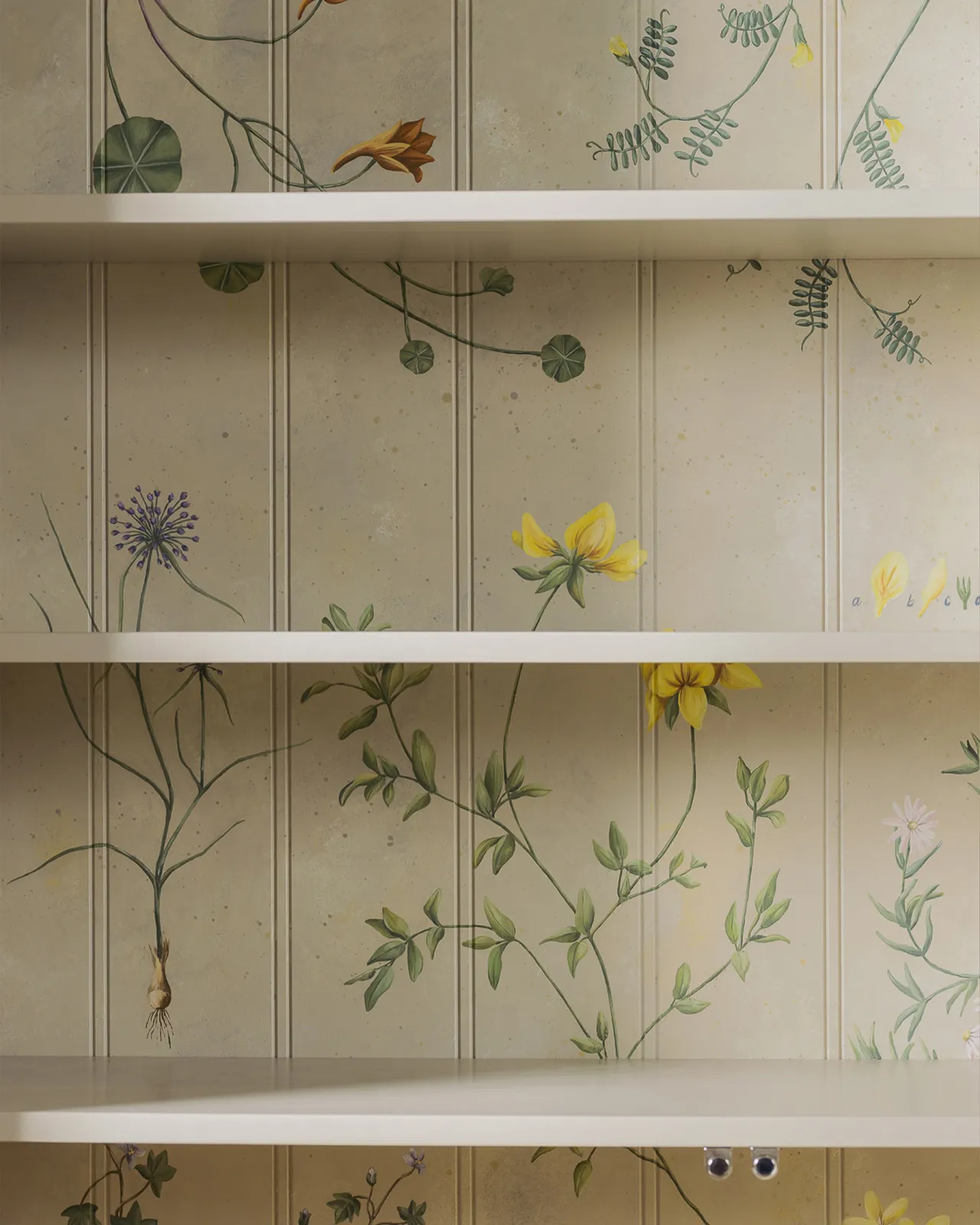 The interior of a display cabinet with a cream interior and traditional painted botanical plants and motifs on the tongue and groove back panel.