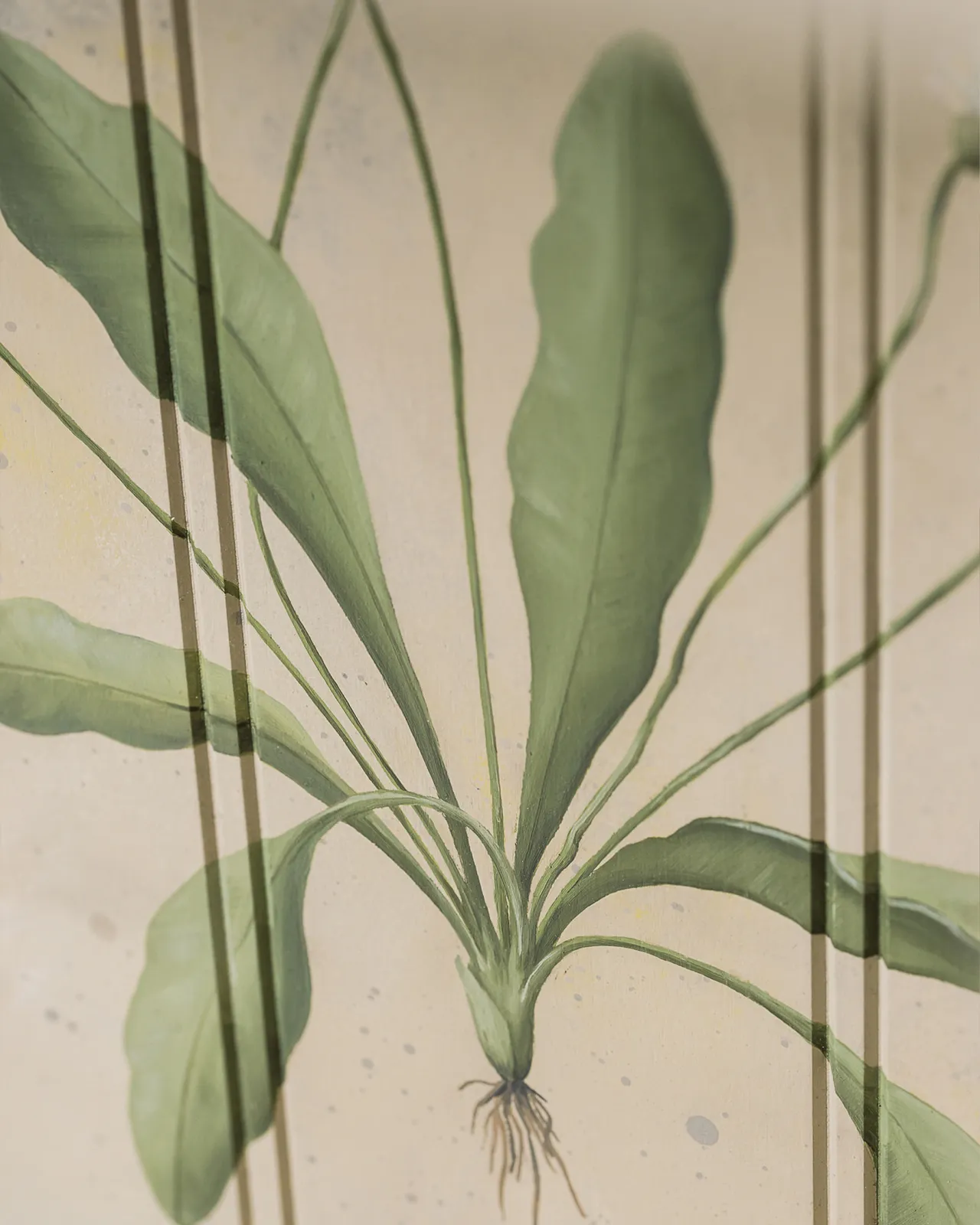 A close-up view of a painted botanical plant on a cream tongue and groove back panel.