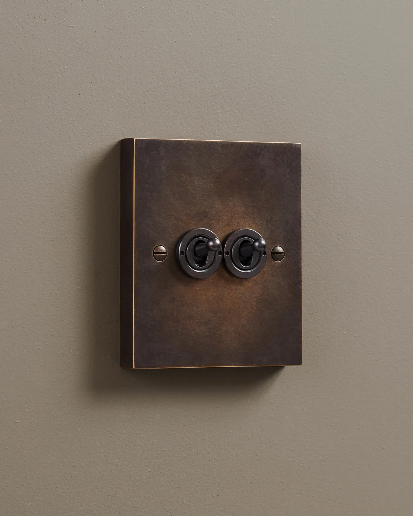 A 2 gang Box Toggle Switch in an Oxidised Brass finish.